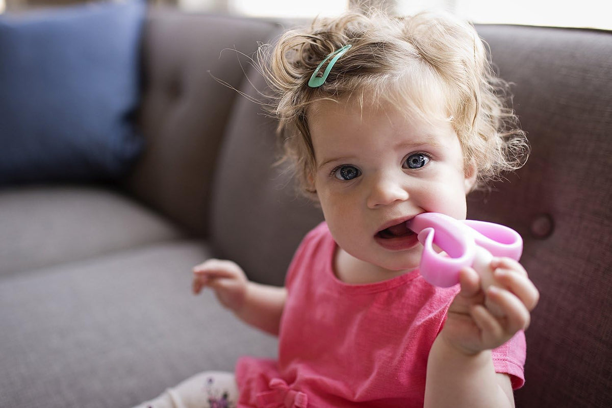 ® Pink Teether-Toothbrush for Infants and Toddlers, Made in the USA with Soft Bristles for Gentle Oral Care, Bendable Food-Grade Silicone, Family-Owned Since 2009, Over 11 Million Units Sold